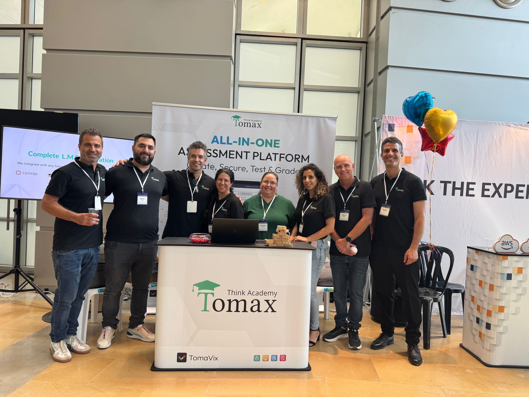 Tomax team at an industry conference booth
