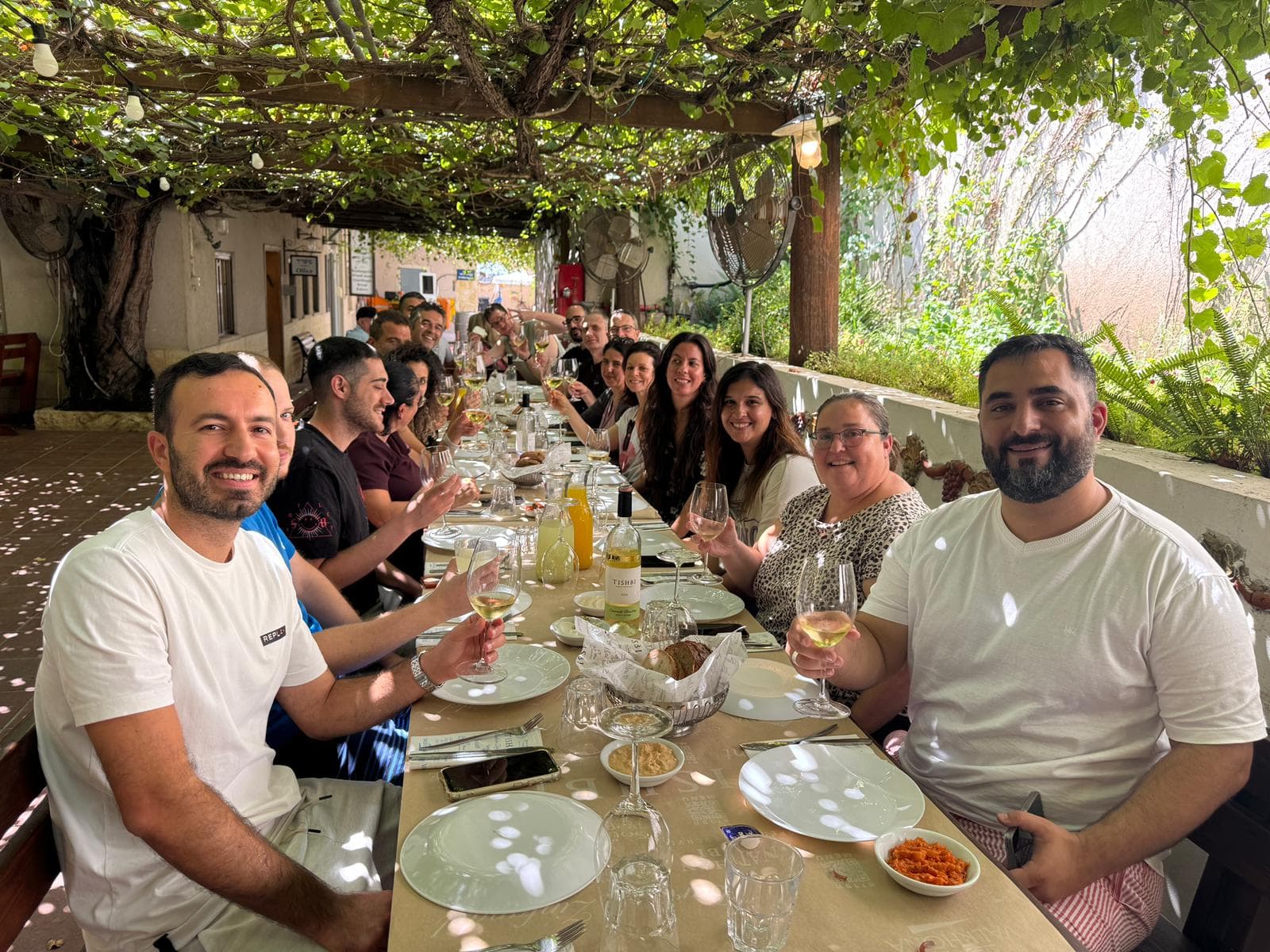 Tomax team sharing a meal together outdoors