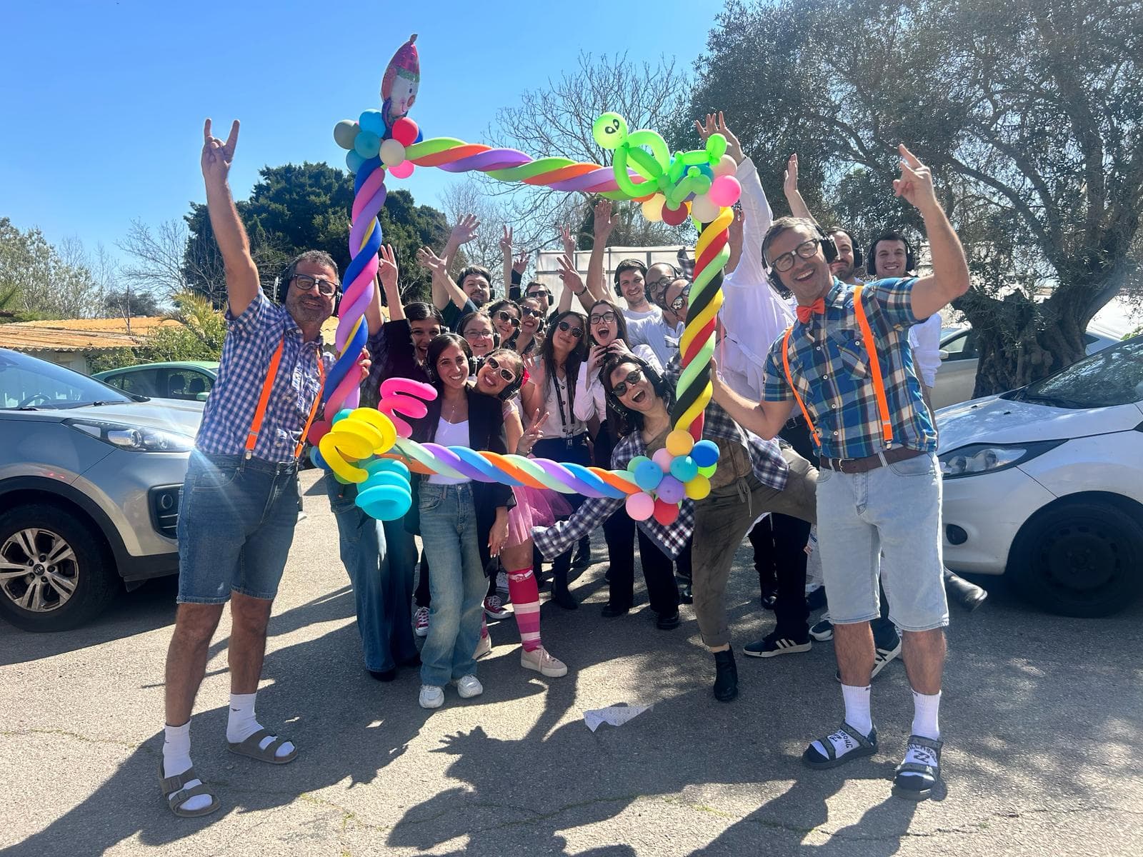 Tomax team celebrating at an outdoor costume party